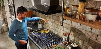 kitchenaid-range-hood-man-cooking